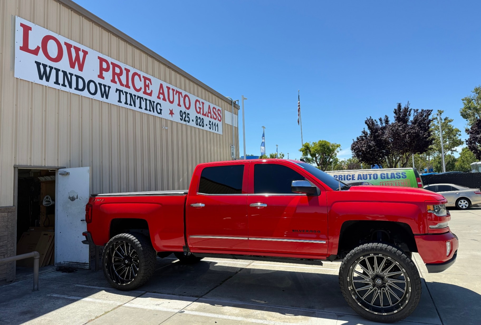 Lifted red Chevy Silverado tinted at our Dublin, CA shop
